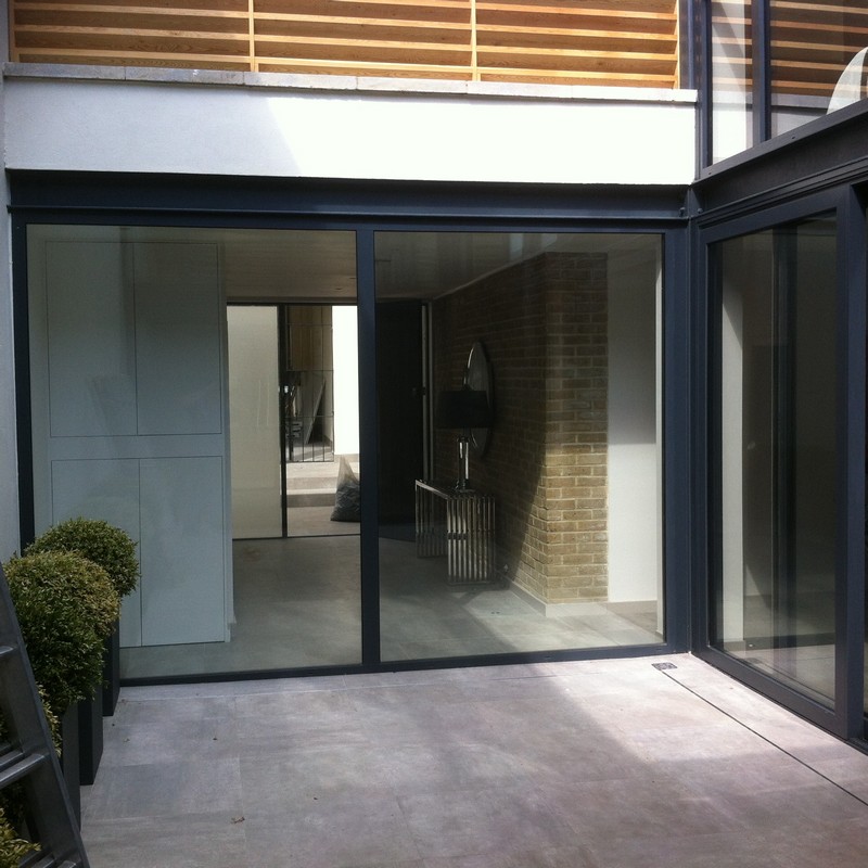 Floor-to-ceiling sliding doors opening to courtyard in Parson's Green