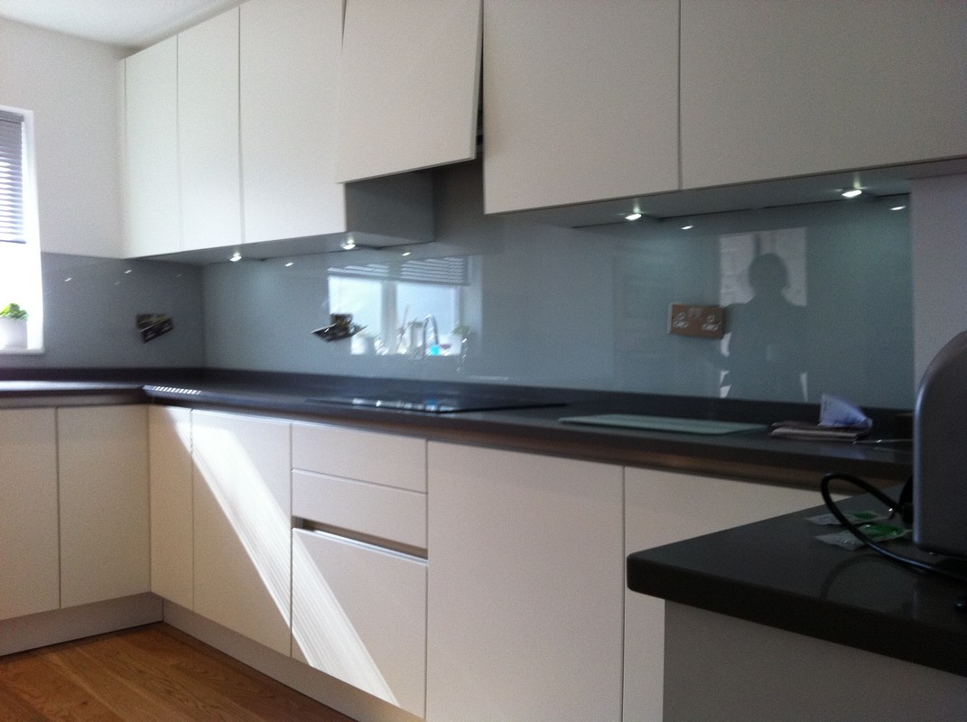 Grey glass kitchen splashback with LED lighting in Parson's Green